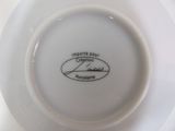 a white plate with a black and white label on it