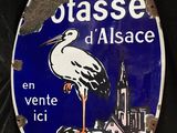 a blue and white sign with a stork on it