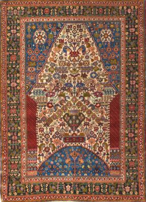 an antique persian rug with a floral design on a blue ground