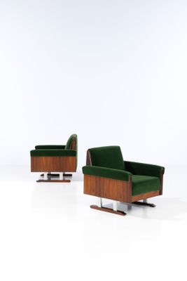pair of mid - century danish lounge chairs with green velvet upholstered seats