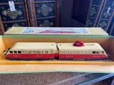 two toy trains sitting in a box on a table