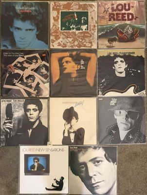 a lot of records on the floor of this room