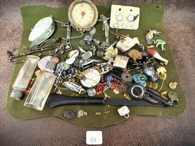a pile of assorted items on a green cloth