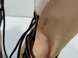 someone is wearing a pair of shoes with laces on them
