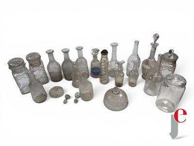 a lot of glass bottles that are sitting on a table