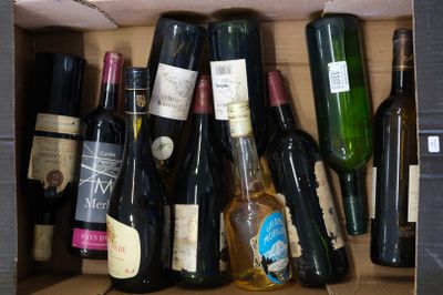many bottles of wine in a box on the table