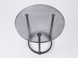 an image of a glass table with two metal legs and a glass top
