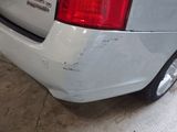 a white car that is parked in a garage