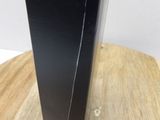 a black box that is sitting on a wooden table