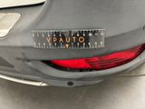 the back end of a car with a sticker on it