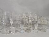 a lot of wine glasses that are sitting on a table