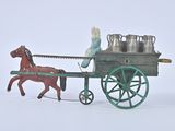 a toy horse pulling a cart with milk cans on it