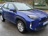 a blue toyota rav parked on the side of the road
