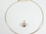 silver necklace with black pearl and gold plated clasp