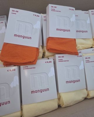 boxes of orange and white men ' s underwear stacked on top of each other