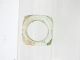 a glass jar with a ring inside of it