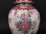 an image of a white and pink vase with flowers on it
