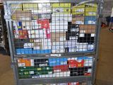 a metal cart with many boxes on it in a warehouse