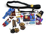 an assortment of medals and medals are displayed on a white surface