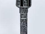 a black and white vase with a design on it