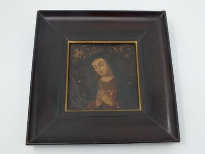 painting of a woman in a black frame on a white wall