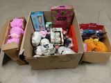 a cardboard box filled with various items on the floor