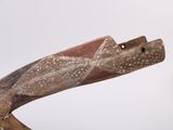 a wooden sculpture of a bird with a long neck
