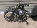 a bike that is parked next to a garage door