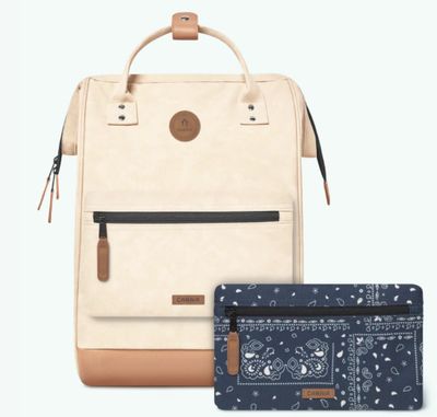 an image of a backpack and wallet sitting next to each other