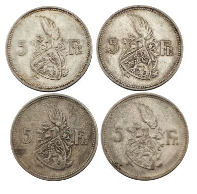 quatre pièces britanniques, une en argent, une en argent et une en argent