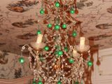 a chandelier hanging from the ceiling in a room