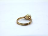 an image of a gold ring with a pearl on it
