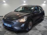 the new ford focus is parked in a showroom with checkered flooring