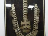 a picture of a picture of a necklace with coins on it