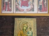 three framed pictures of the virgin and child are on a wooden table