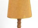 an image of a table lamp with a brown shade on top of it