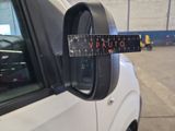 a picture of a car mirror with a sticker on it