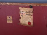 a piece of paper hanging on the wall next to a pair of scissors