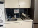 a kitchen with a washer and a dryer in it