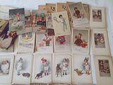 many pictures of children and dogs on the table