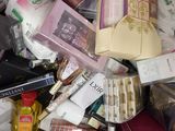 many different types of cosmetics and beauty products in this pile