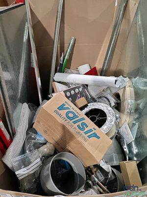 a cardboard box full of assorted items in a room