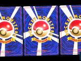 three cards with a red and white ball on top of each other