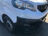 a white van that is parked in the parking lot