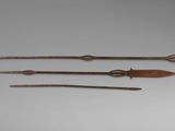 three different types of weapons are displayed on a gray surface