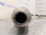 a metal pipe that is sitting on a table