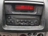 a car dashboard with a digital clock on it