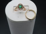 a white box with a ring and a green ring on it