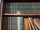 many old books on the shelves in the room