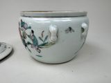a white bowl with a flower design on it and a plate with a saucer on it